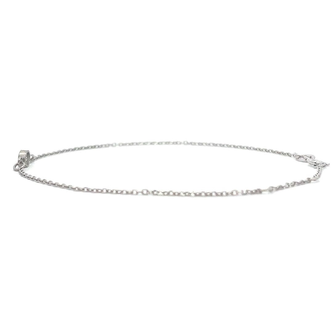 Silver bracelet with a single diamond pendant on a white background.