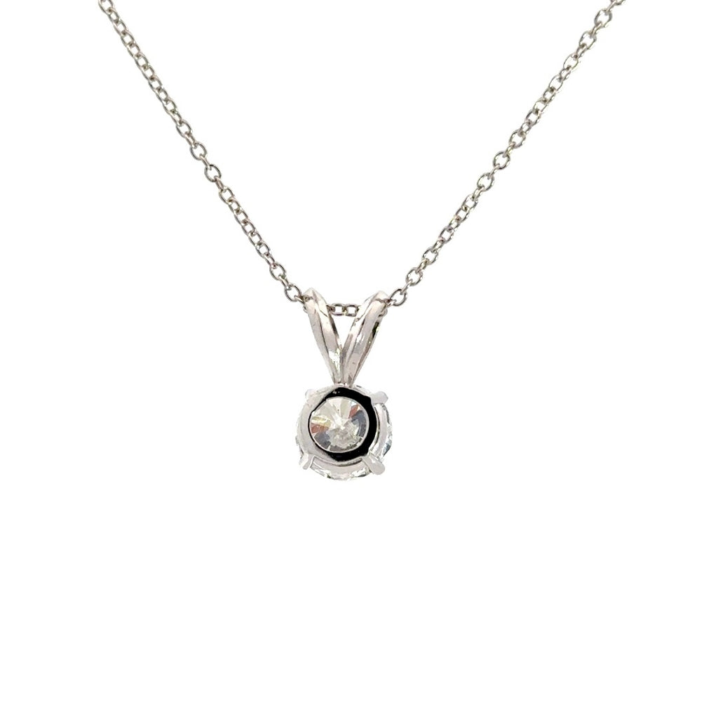 Silver necklace with round cut diamond pendant on a white background