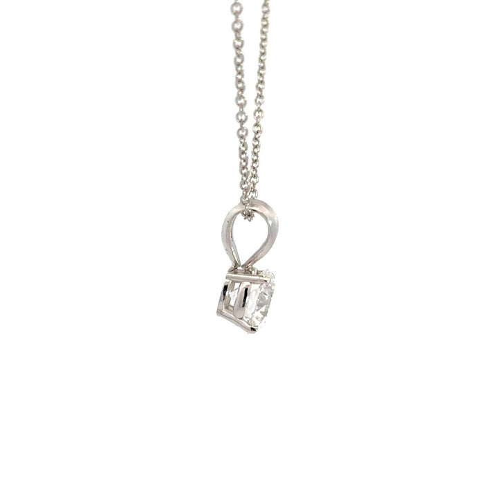 Silver necklace with round cut diamond pendant on a white background