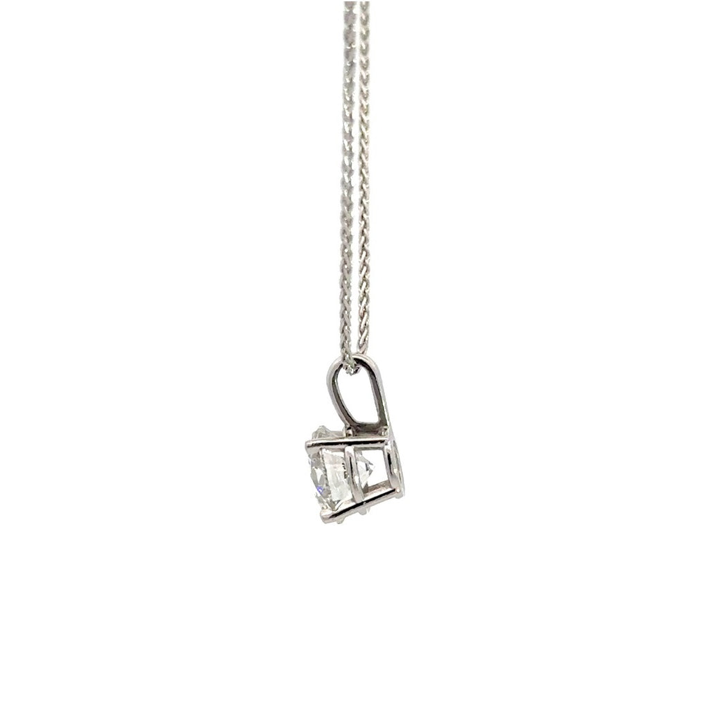 Silver necklace with round cut diamond pendant on a white background