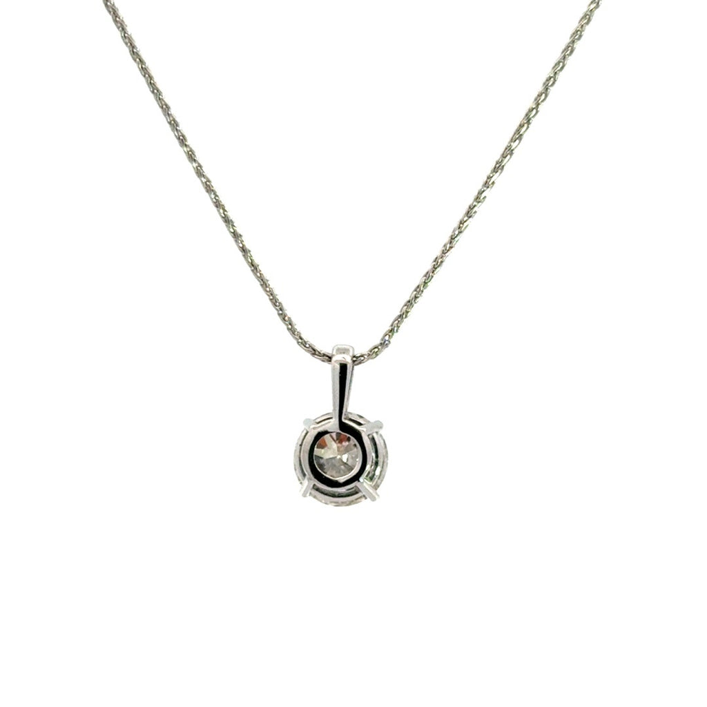 Silver necklace with round cut diamond pendant on a white background