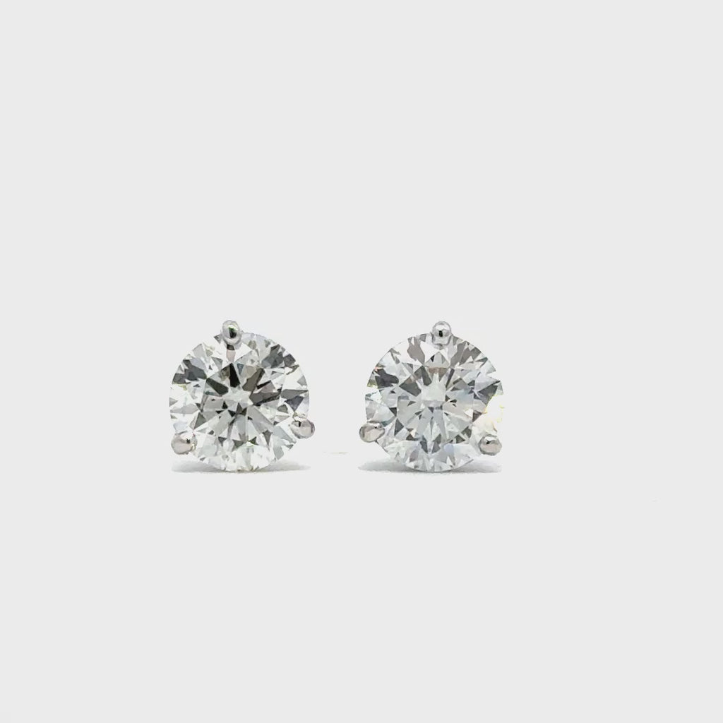 Silver stud earrings in a white background