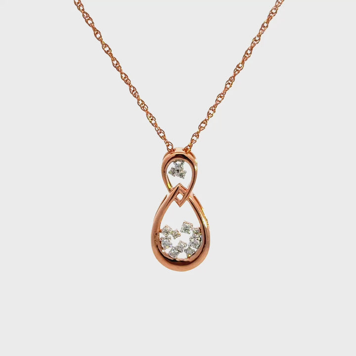 Rose gold infinity necklace with diamonds on a white background