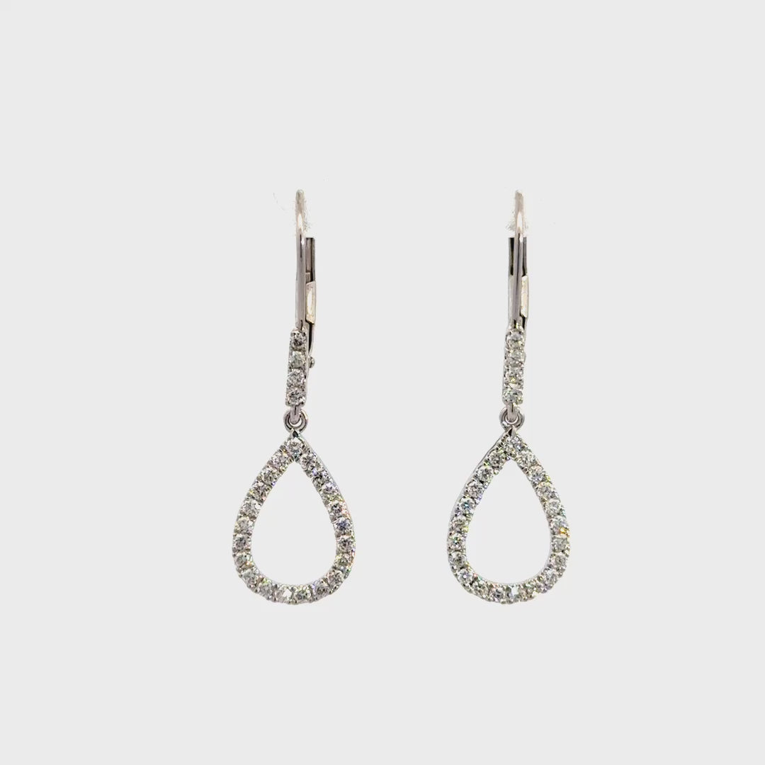 Silver teardrop dangle earrings on a white background