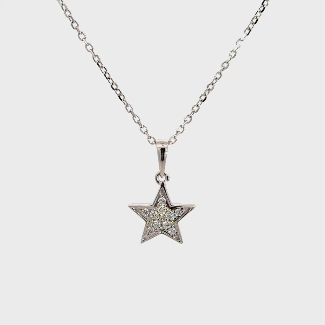 Diamond star necklace on a white background