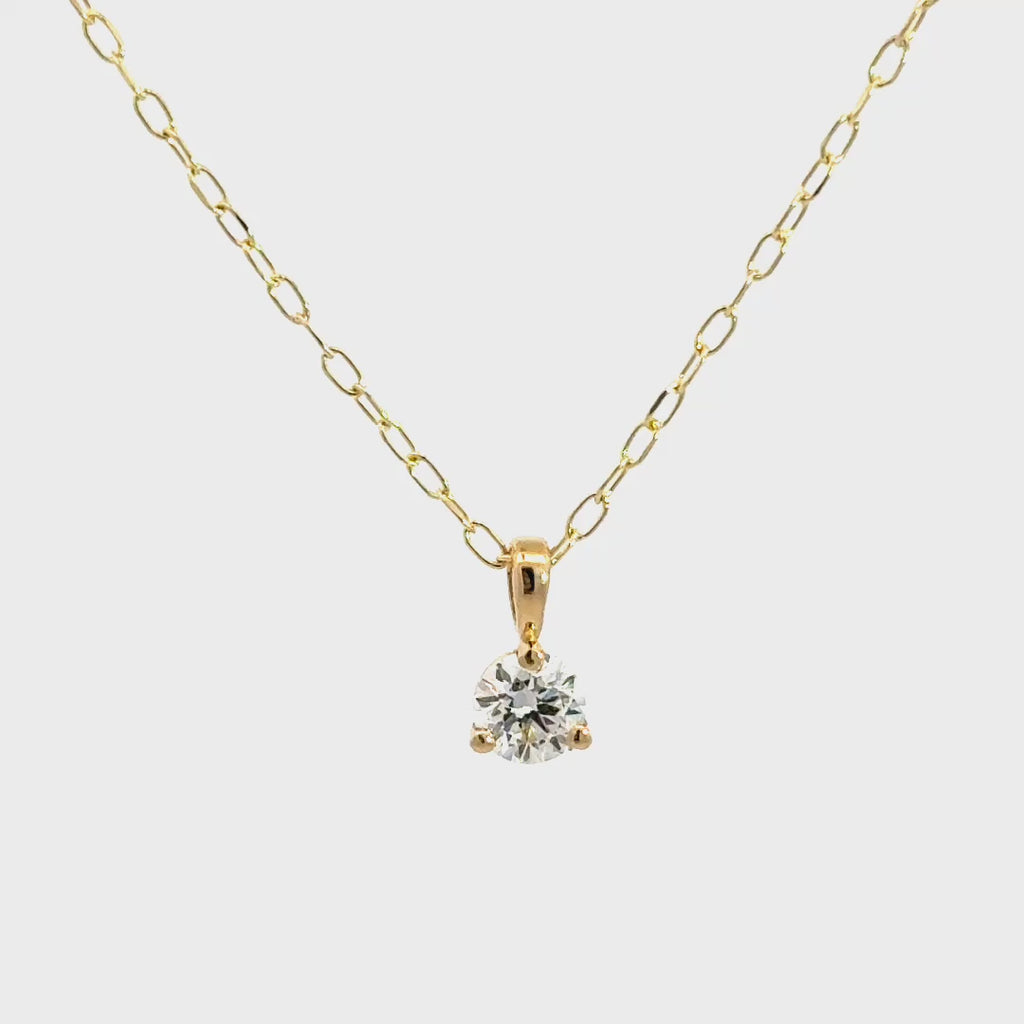 Yellow gold diamond necklace on a white background.